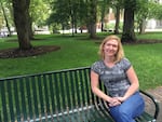 Sharon Raymor sits on a bench on the South Park Blocks, not far from where she currently works for the City of Portland. She spent more than four years in Facilities and Asset Management at Portland Public Schools.