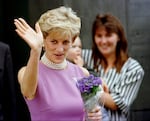 Diana, Princess of Wales, waves to the crowd as she leaves the Victor Chang Cardiac Research Institute in Sydney Australia, Nov. 1, 1996.