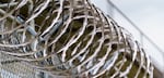Razor wire at the Oregon State Penitentiary in Salem, Ore., May 19, 2021.