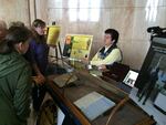 Oregon State Archivist Mary Beth Herkert tells visitors to the Oregon capitol about the original state constitution. The Secretary of State's office says the current display case leaves the document vulnerable to theft and climate-induced degradation.