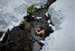 To fully understand the experience of cold dipping, OPB producer Ian McCluskey tests the waters of a creek in the Mt. Hood National Forest.