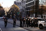 Law enforcement officials secure the scene after two National Guard members were shot in downtown Washington, D.C., on Wednesday.,