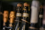 Bottles of Prosecco are lined up on a shelf of a wine shop in Rome, Thursday.