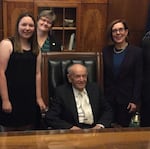 Claire Sarnowski, left, and Alter Wiener, seated, with Oregon Gov. Kate Brown.