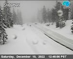 This image from a Caltrans traffic camera shows snow conditions on California SR-89 Snowman in Shasta-Trinity National Forest, Calif., Saturday, Dec. 10, 2022. A stretch of California Highway 89 was closed due to heavy snow between Tahoe City and South Lake Tahoe, Cali., the highway patrol said. Interstate 80 between Reno and Sacramento remained open but chains were required on tires for most vehicles.