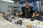 Chef Javier U. Lopez prepares fresh food in the Sysco test kitchen at its distribution center in Houston. Sysco Corporation helps restaurateurs get the best bang for their buck by providing everything from pre-cut ingredients to menu creation.