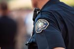A Portland Police officer watches the crowd at an LGBT vigil in Northwest Portland following the shootings in Orlando in June. Portland officers do not currently wear body cameras.