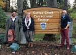 (Left to right) Paul Susi, composer/cellist Anna Fritz, and director Patrick Walsh in front of the Coffee Creek Correctional Facility in Wilsonville, Ore., where Susi performed in 2018.