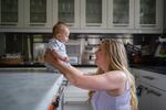 Lauren Miller with her 3-month-old son, Henry, at home in Dallas.