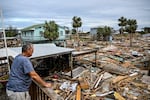 David Hester inspects damages of his house after Hurricane Helene made landfall in Horseshoe Beach, Fla., on Saturday.