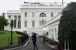 Members of the press are seen outside the White House in Washington, D.C., on Sept. 21.