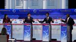 From left to right, former U.N. Ambassador Nikki Haley, Florida Gov. Ron DeSantis, businessman Vivek Ramaswamy and Sen. Tim Scott, R-S.C., argue a point during a Republican presidential primary debate at the Ronald Reagan Presidential Library in Simi Valley, Calif., on Wednesday.