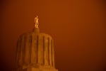 Wildfire smoke turns the sky orange at the Oregon Capitol in Salem, Ore., Sept. 8, 2020. Unprecedented wildfire conditions across Oregon and the American West kicked up several fires over Labor Day weekend.