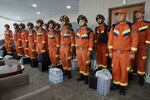 In this photo released by Xinhua News Agency, Chinese rescuers arrive at the Yangon International Airport in Yangon, Myanmar on Saturday, March 29, 2025.