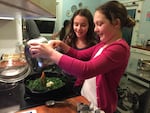 Willa Gagnon, left, and Maeve Larco prepare Mark Bittman's Skillet Spanakopita in January 2015.