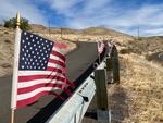Tattered American flags wave in the strong wind of the Columbia River Gorge National Scenic Area on Oct. 27, 2020.