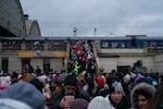 Displaced people from eastern Ukraine spill out of a train station in Lviv, in western Ukraine, last March. At this point, more than 2 million people had fled the country as a result of Russia's invasion.