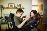 Shasta Kearns Moore and her son Malachi watch a video together in their home near Portland on Sept. 13, 2024.