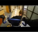 In video footage released by the Milwaukie Police Department, an officer can be seen rolling Descamps in a wheelchair to exit the hospital emergency room.