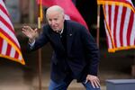 President-elect Joe Biden waves to supporters after speaking at a drive-in rally for Georgia Democratic candidates for U.S. Senate Raphael Warnock and Jon Ossoff, Tuesday, Dec. 15, 2020, in Atlanta.