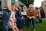 Kotek, right, talks with twins Joey and Aubrey Hager, left, and their mom, Kelly Hager, at the pancake breakfast.