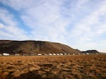 A line of cars queued on a road heading to the town of Grindavik, Iceland, Monday.