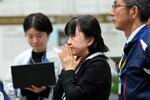 Staff of the Japan Aerospace Exploration Agency (JAXA) watch a live stream of the moon landing by the Smart Lander for Investigating Moon (SLIM) spacecraft at JAXA's Sagamihara Campus near Tokyo.