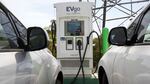 Electric cars are parked at a charging station in Sacramento, Calif.