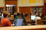 Patrons and staff at Multnomah County's Central Library in downtown Portland, Ore. on Aug. 22, 2025. Many arrive at the library to escape soaring temperatures during the latest heat wave.
