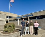Springfield School District was an early adopter of the new cellphone free policy. Here, Springfield School District Communications Director Brian Richardson (left) stands with students, Jose Mojarro-Avelar, Leesi Brock and Violett Lloyd in the commons area of Springfield High School.
