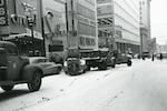 Snow removal operations at SW 6th Ave and Washington St looking north, Portland, Ore., Jan. 4, 1952.