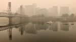 A view of downtown Portland from the East Bank Esplanade is seen on Monday, Sept. 14, 2020. The entire Portland metropolitan region remains under a thick blanket of smog from wildfires that are burning around the state and residents are being advised to remain indoors due to hazardous air quality.