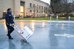 A delivery man takes vaccine doses to Oregon Health & Science University on Marquam Hill in Southwest Portland in 2021. A new federal appeals court ruling dealt with the issue of vaccination mandates in Oregon.