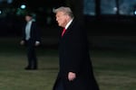 President Trump arrives back at the White House after visiting New Orleans to attend the Super Bowl. A federal judge on Monday found that the administration has not fully followed his order to unfreeze federal spending.