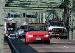 FILE - In this Aug. 4, 2011, file photo, taken in Portland, Ore., traffic crosses the Interstate 5 bridge spanning the Columbia River between Oregon and Washington. 