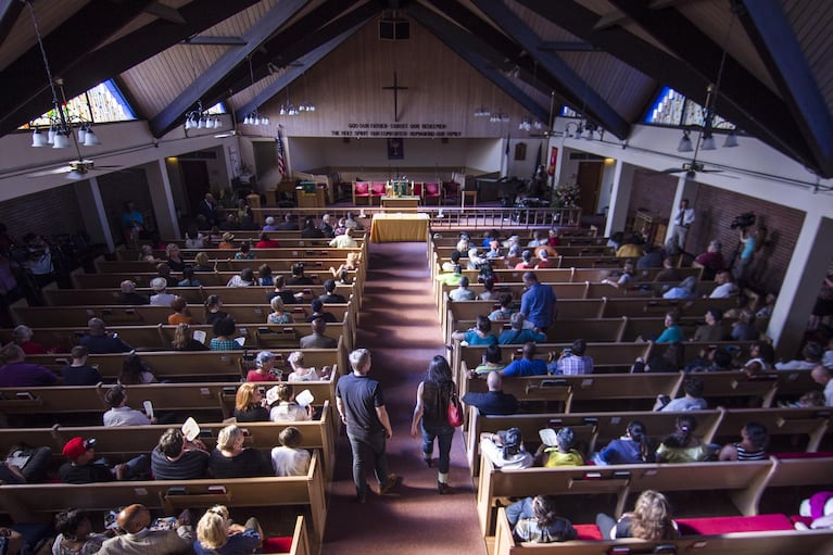 Hundreds attended the candlelight vigil held at Bethel A.M.E. Church in Portland, in honor of victims of a suspected racially-motivated attack in Charleston, South Carolina.