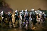 Law enforcement teams disperse the crowd of protesters after they gathered outside the home of Portland City Commissioner Dan Ryan, Nov. 5, 2020.