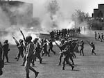 Ohio National Guard members towards students at Kent State University in Kent, Ohio, on May 4, 1970. They fired into the crowd, killing four students and injuring nine.
