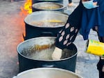 Hani's sister Faten, aka Chef Faten, helps make khubeza stew and serves it to family and neighbors in north Gaza.