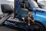 Sumanoharan Narayanan, head of autonomous technology at Daimler Truck North America, in front of an electric autonomous semi-truck during a tour of the company's North American headquarters.