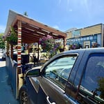 On July 16, 2026, the covered in-street dining structure at Bar Purlieu restaurant suffered its third crash. The co-owner said he had a “weird feeling” that day watching the traffic whiz by on Willamette Street, so he parked his own truck in a space right in front of the patio structure, also called a “parklet.” Forty-five minutes later, an SUV crashed into the truck, sending diners inside scrambling for safety.