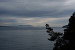 FILE - Mountains rise above the Salish Sea as seen from San Juan Island, Wash., Friday, Oct. 10, 2025.