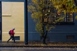 FILE: A person walks past the Northrup Shelter, an emergency overnight shelter in Portland, Ore,. on Thursday, Nov. 27, 2025. The shelter is one of several opened since Portland Mayor Wilson entered office in January.