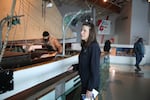 Caroline Levin, with the Columbia River Maritime Museum, awaits guests from the cruise ships on April 18, 2026.