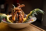 In this undated photo provided by The EAST by Trap Kitchen, one of the Portland restaurant's signature pineapple dishes is displayed. The inner eastside restaurant held its grand opening on April 24, 2026.
