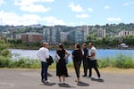 Project partners take a tour of the Portland waterfront on June 11, 2024, while discussing what it will look like once the project is completed.