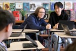 David Douglas High School teacher Michelle Wood, left, demonstrates “proximity,” a strategy to manage student behavior, with junior Kevin Le on April 5, 2023. Wood teaches an Intro to Education class that is part college course, part classroom internship for students who are interested in becoming teachers.
