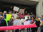 Portland's Chapter of the national group Showing Up For Racial Justice holds a rally in front of the Justice Center calling for police accountability after recent police shootings of people of color.