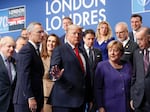 In this file photo, then-President Donald Trump, center, gestures as he walks off the podium after a group photo at a NATO leaders meeting in Watford, Hertfordshire, England on Dec. 4, 2019. Trump says he once warned that he would allow Russia to do whatever it wants to NATO member nations that are “delinquent” in devoting 2% of their gross domestic product to defense.