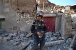 Rescue teams and civil protection members search the rubble for bodies of victims that perished in the devastating earthquake in Imi N'Tala, Morocco, on Sept. 13.